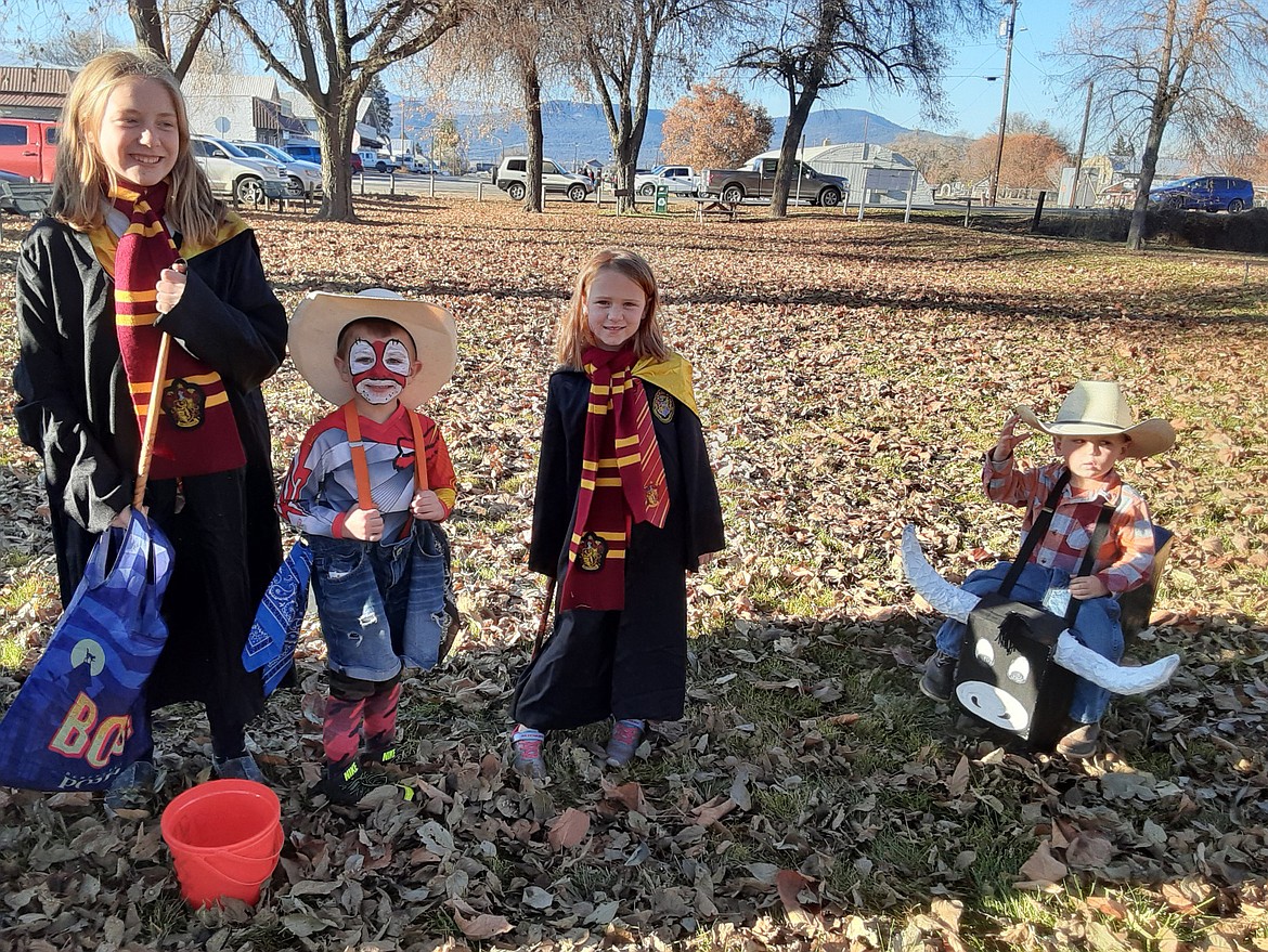 Karissa,  Lane, Paisley and Maverick show off their costumes on Halloween.