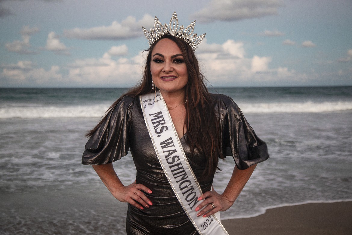 Mrs. Washington Amy Dana, of Moses Lake, poses with her crown and sash on a Florida beach. She said the pageant win gives her a chance to raise awareness of Bell’s palsy and to provide support for Bell’s palsy patients.