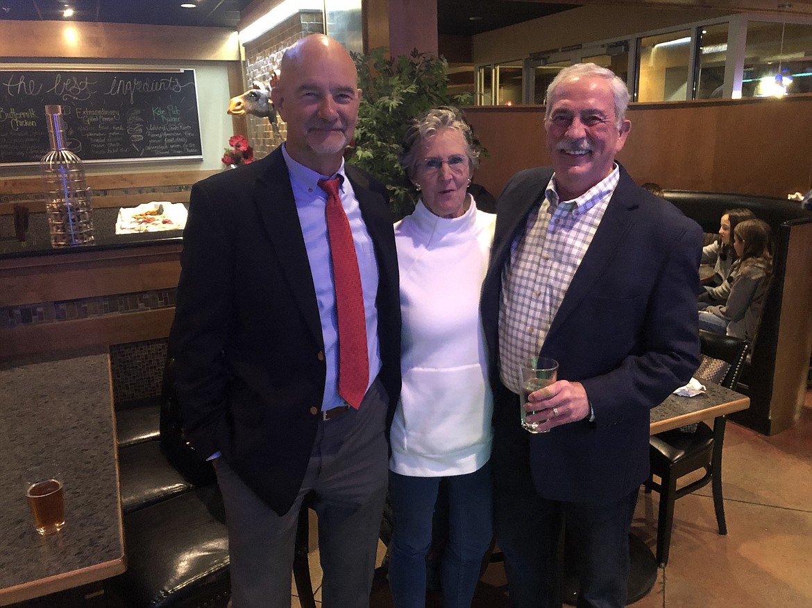 From left, Post Falls Mayor Ron Jacobson, former Coeur d’Alene Mayor Sandi Bloem and CDA mayoral candidate Jim Hammond pose for a shot Tuesday night at Season’s in downtown Coeur d’Alene. (MIKE PATRICK/Press)