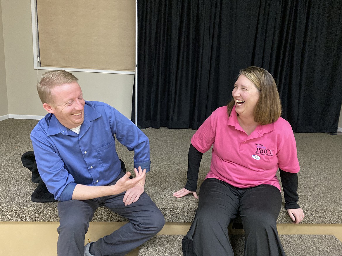 Coeur d'Alene City Council candidates Roger Garlock and Elaine Price share a laugh while waiting for election results Tuesday night. (MADISON HARDY/Press)