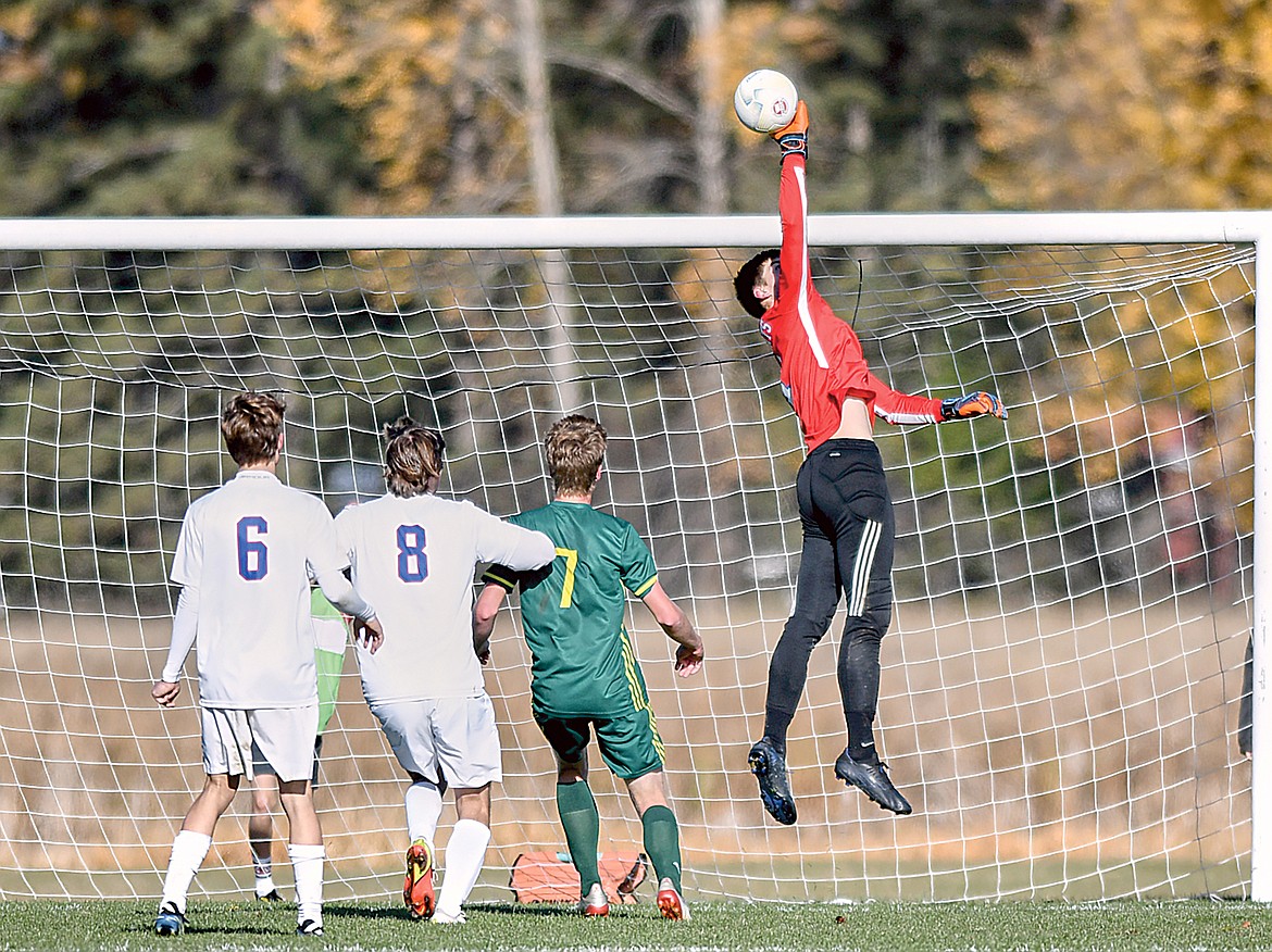 Keeper Bryce Dunham tips away a shot against Whitefish. (JP Edge photo)