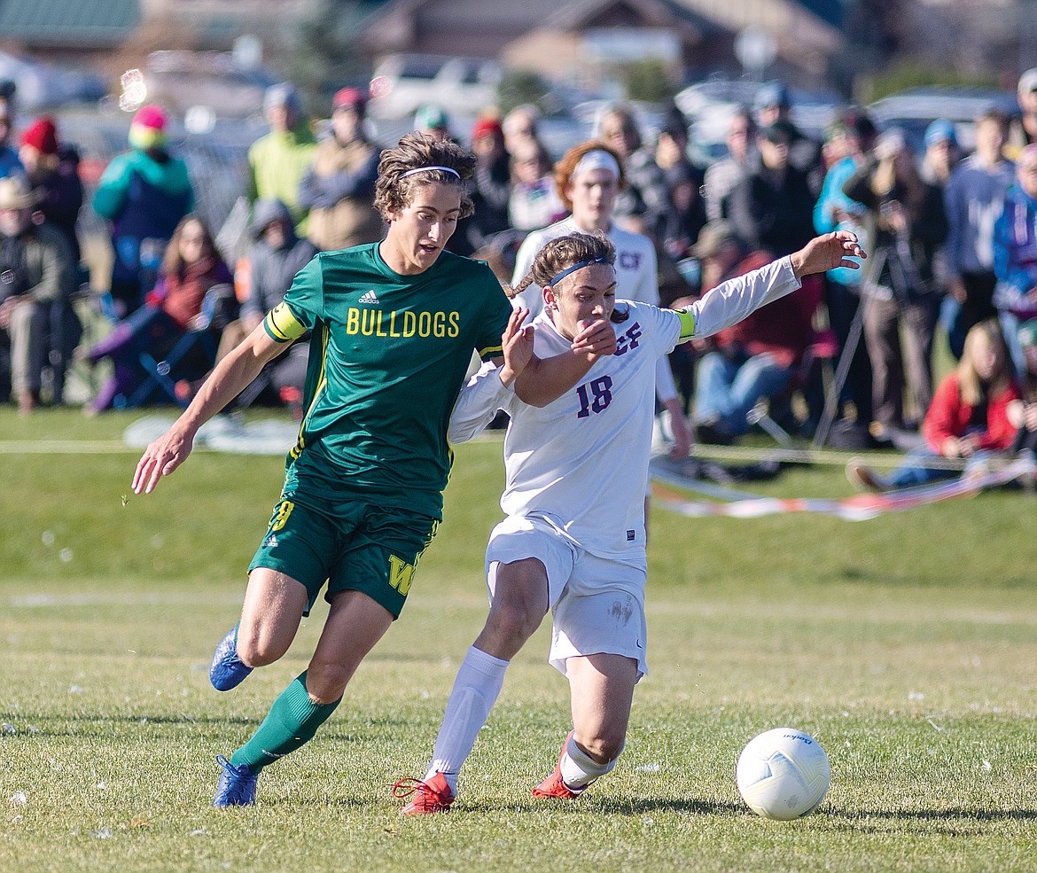 George Robbins, right, defends Whitefish's Gabe Menicke.(Chris Peterson photo)