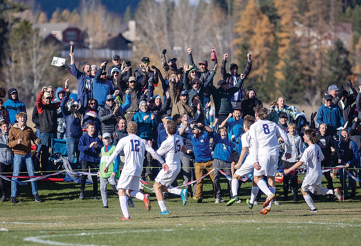 The crowd cheers on the Wildcats after they tied it up with a little more than 11 minutes left in the game. (Chris Peterson photo)