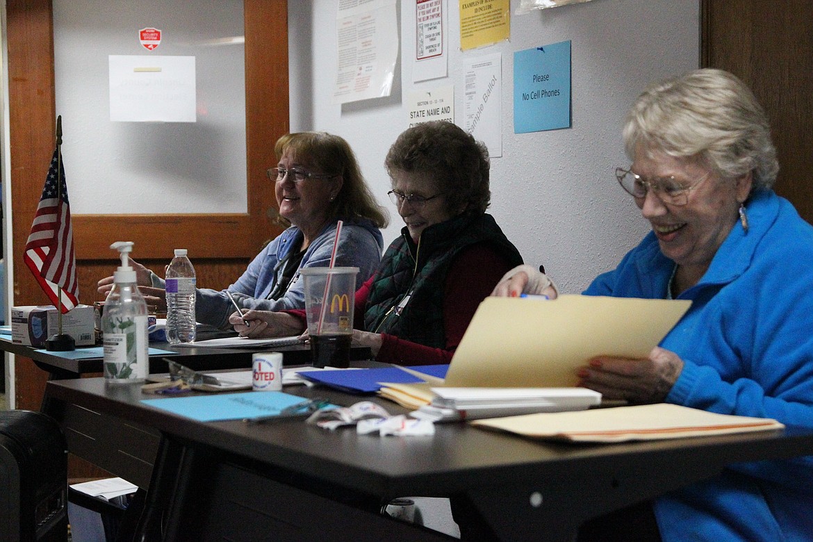 Election judges Jennifer Curtiss, left, Sandy Wagner and Bobbie Stoken helped issue ballots and process votes in Libby's poll election on Nov. 2. (Will Langhorne/The Western News)