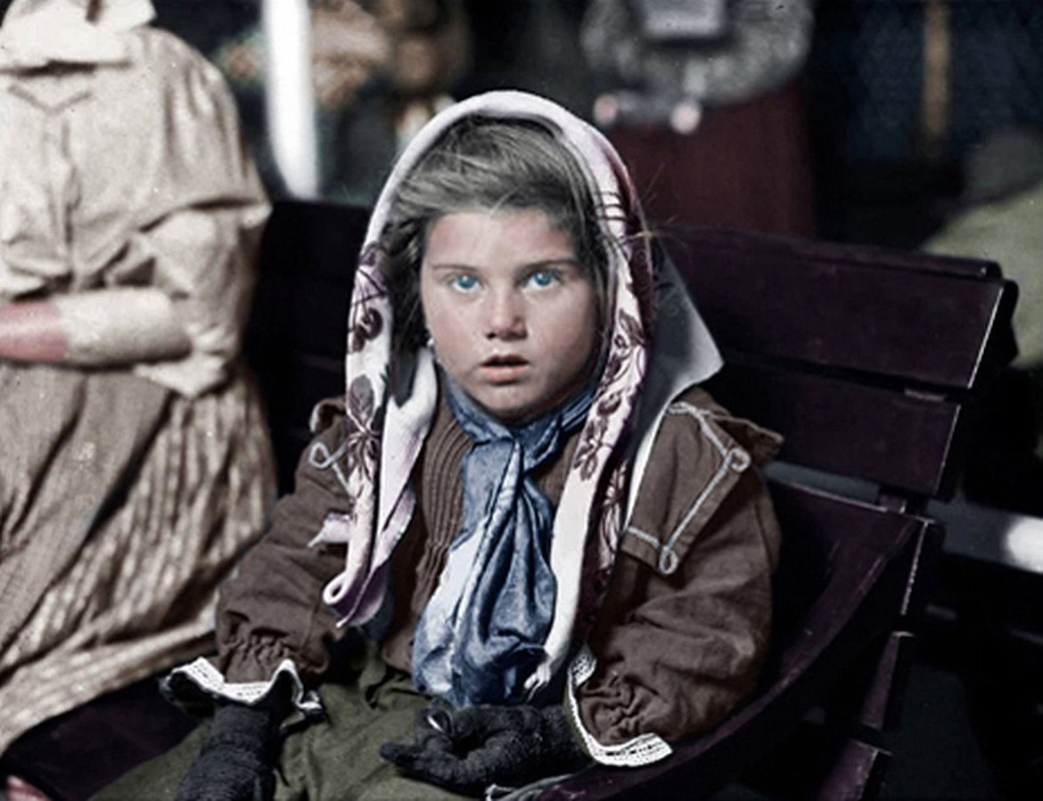 Photographer Lewis Hine captured this Italian immigrant child after finding her first penny at Ellis Island (1926).