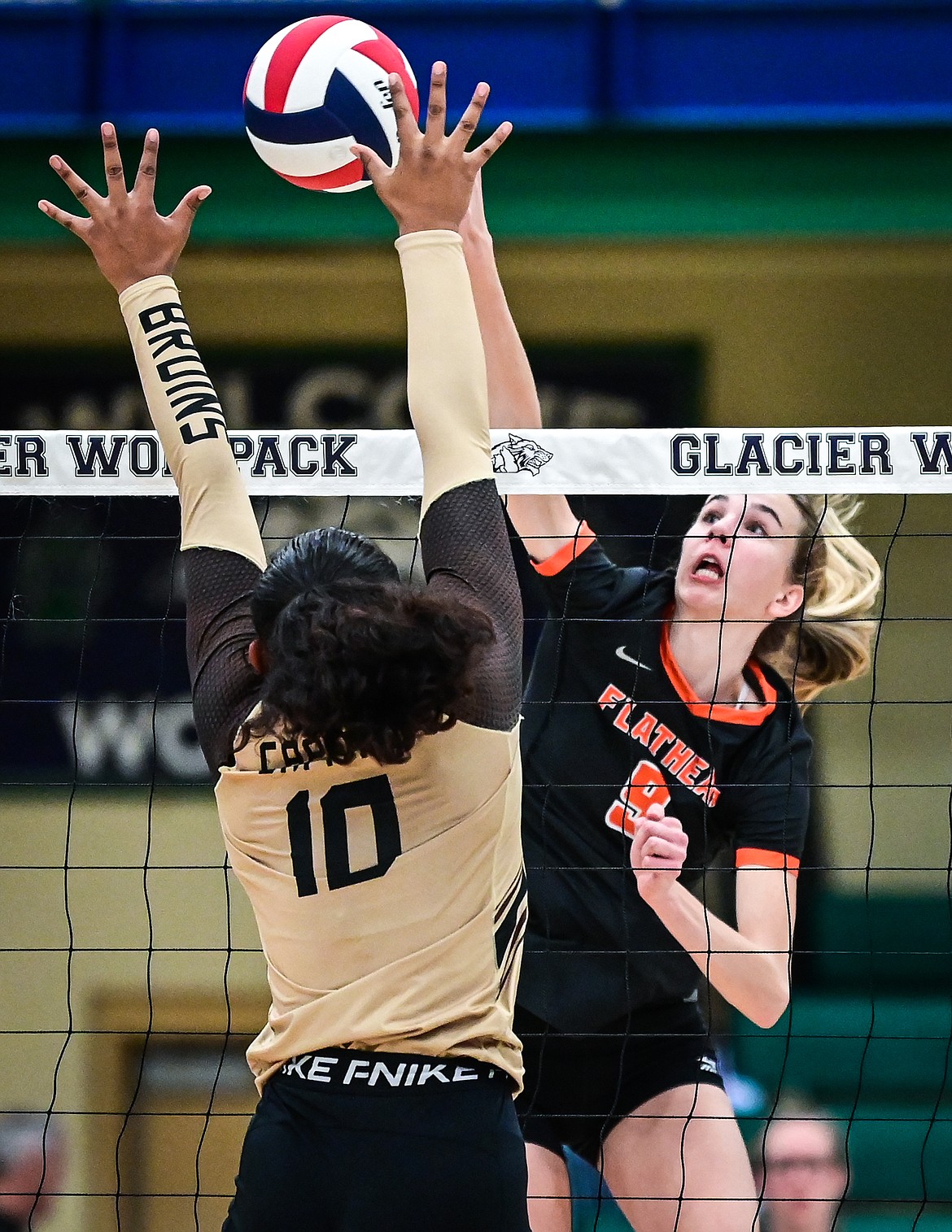 Flathead's Kennedy Moore (10) goes up for a kill against Helena Capital's Nyeala Herndon (10) during Round 1 of the Western AA Volleyball Tournament at Glacier High School on Thursday, Nov. 4. (Casey Kreider/Daily Inter Lake)