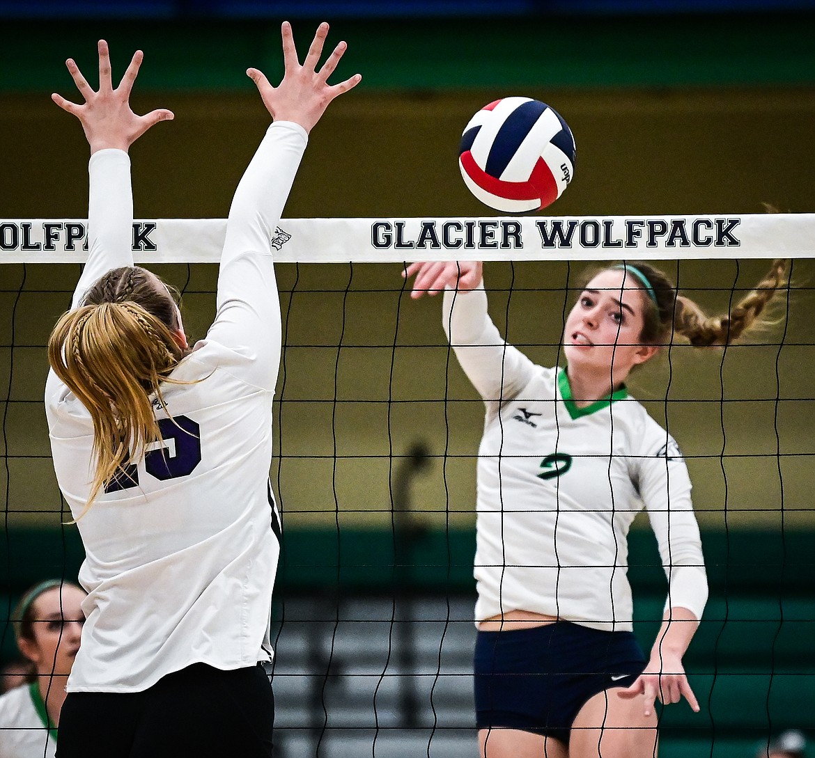 Glacier's Sidney Gulick (2) goes up for a kill against Butte's Ashley Olson (15) during Round 1 of the Western AA Volleyball Tournament at Glacier High School on Thursday, Nov. 4. (Casey Kreider/Daily Inter Lake)