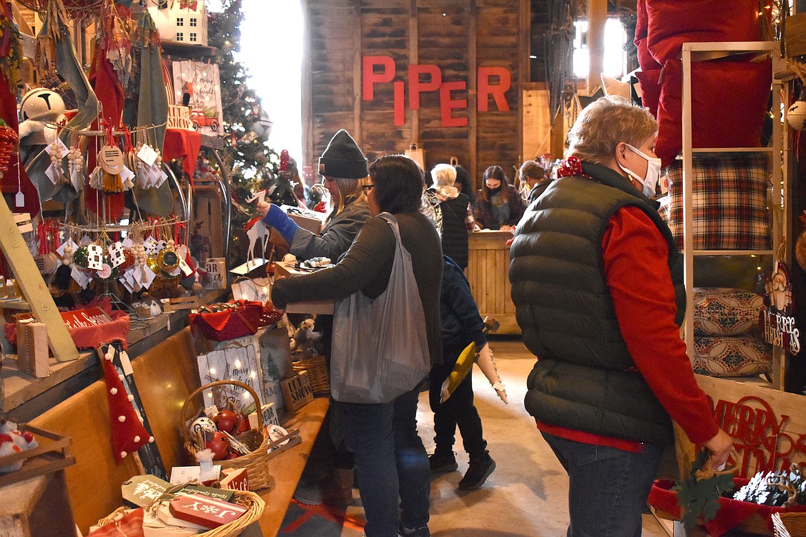 Customers check out the items at the Piper Barn Show.