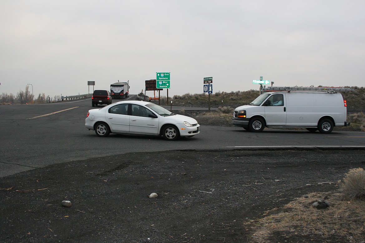 Cars and trucks work their way through the intersection at North Frontage Road and Hansen Road. The intersection can’t accommodate the existing traffic, according to a study by the city of Moses Lake.