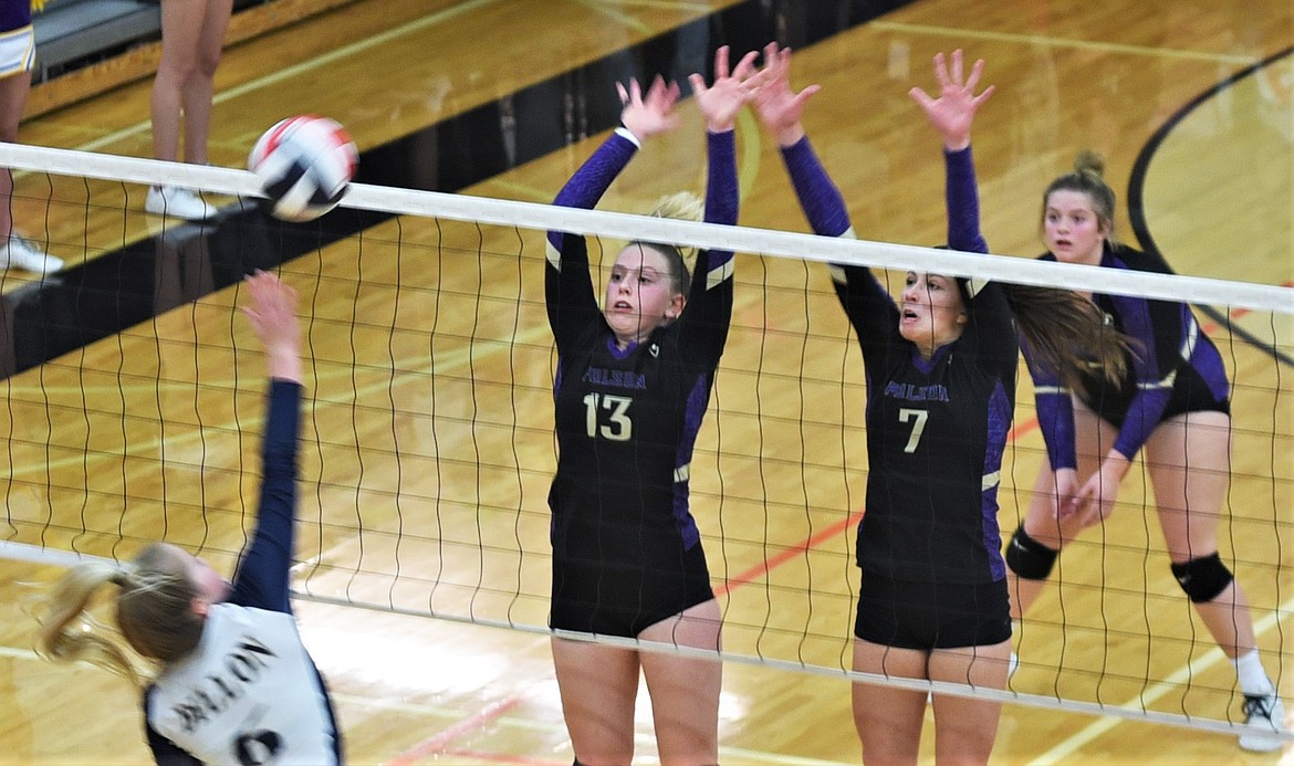 Grace Simonich (13) and Liz Tolley (7) go up to block a shot against Dillon on Thursday as teammate Avery Starr prepares to defend. (Scot Heisel/Lake County Leader)