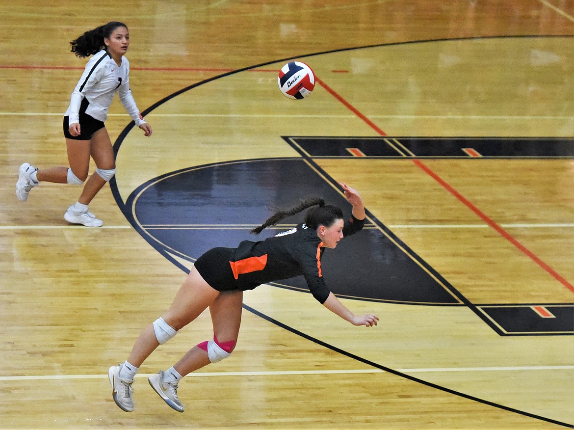 Ronan's Riley Lindquist keeps the ball in play against Corvallis as Margaret Cordova looks to help. (Scot Heisel/Lake County Leader)