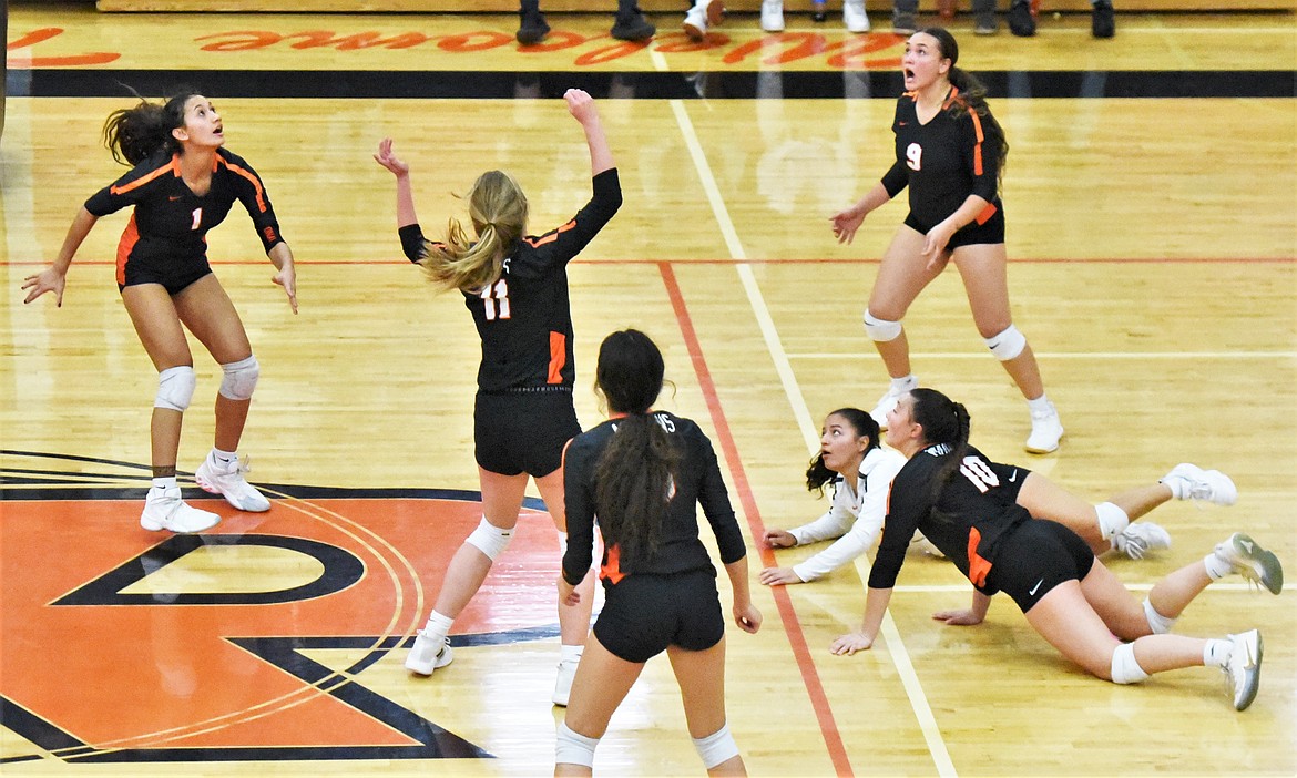 The Maidens scramble to keep a volley going Thursday against Corvallis. (Scot Heisel/Lake County Leader)