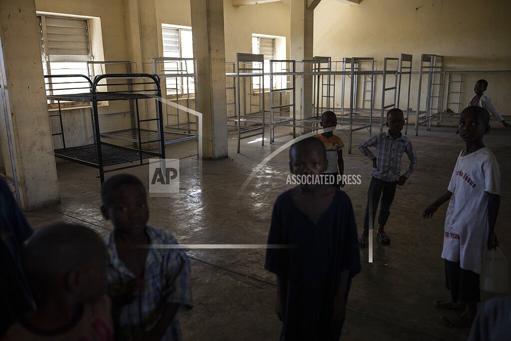 Children stand inside the Centre d'Accueil de Carrefour d'Haiti orphanage, in Port-au-Prince, Haiti, Saturday, Sept. 18, 2021. (AP Photo/Rodrigo Abd)