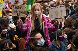 Inside and outside climate talks, youths urge faster action
