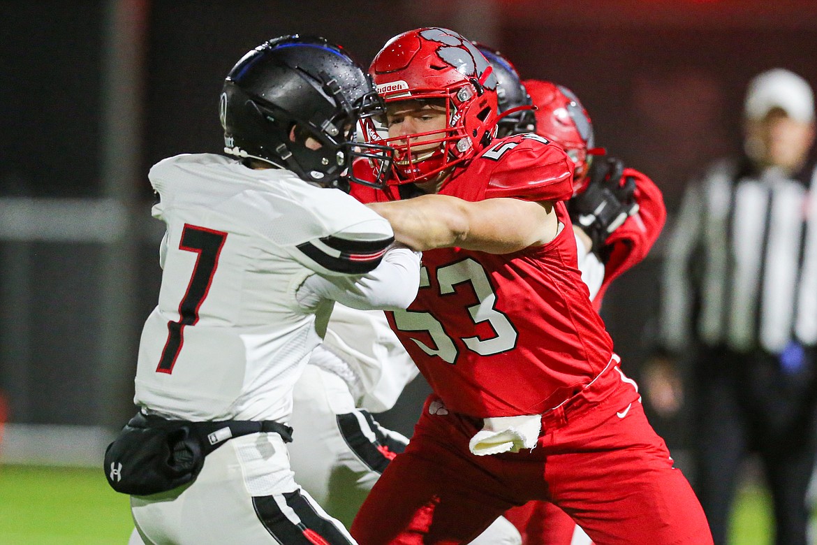 Offensive lineman Ben Stockton blocks a Shelley defender on Friday.