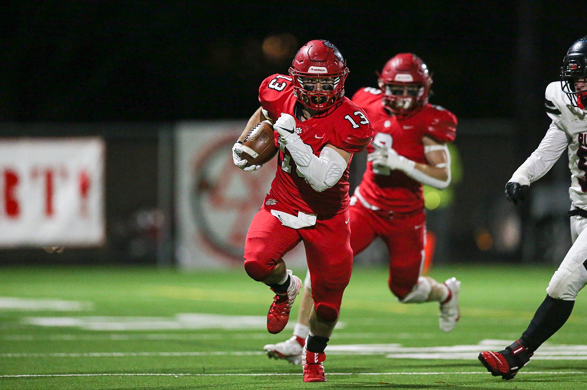 Running back Gerrit Cox rumbles downfield on Friday.