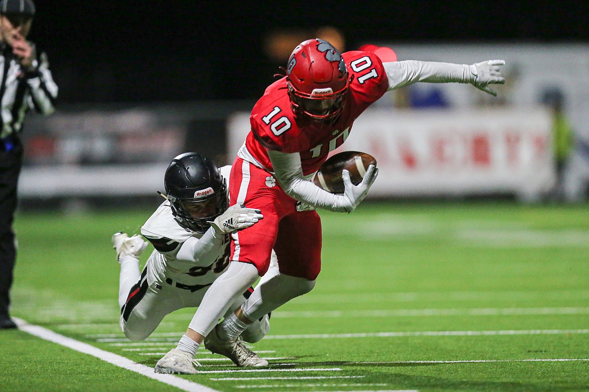 Arie VanDenBerg makes a catch along the sideline on Friday.