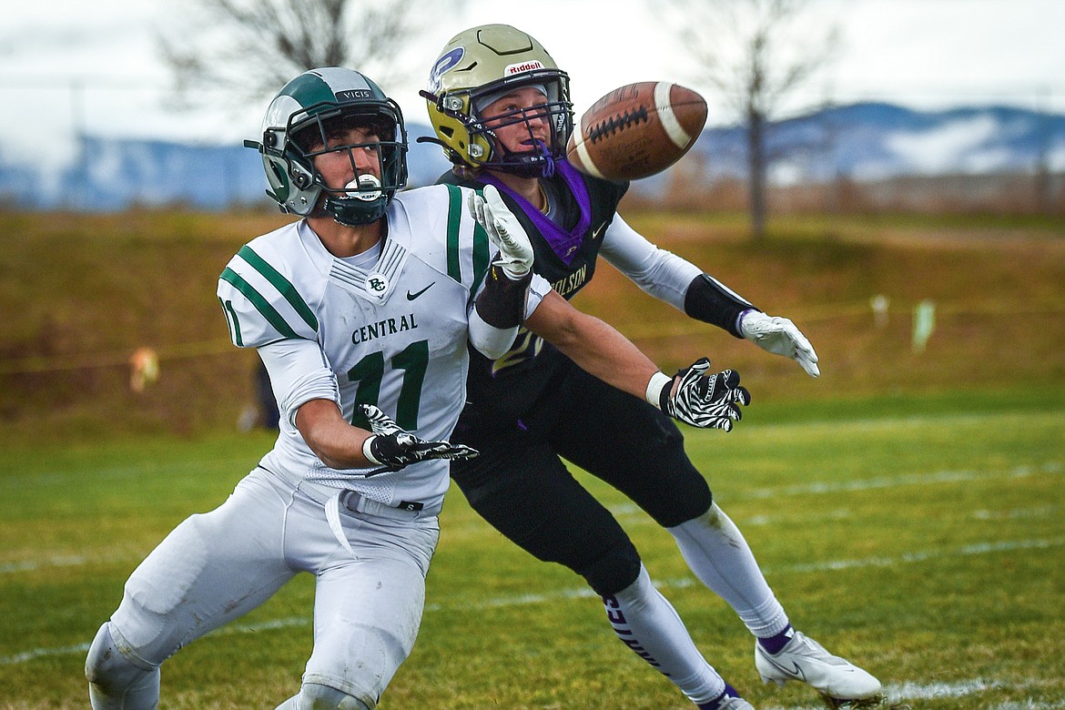 Polson wide receiver Xavier Fisher (20) and Billings Central safety Kade Boyd (11) battle for a ball in the first quarter at Polson High School on Saturday, Nov. 6. (Casey Kreider/Daily Inter Lake)