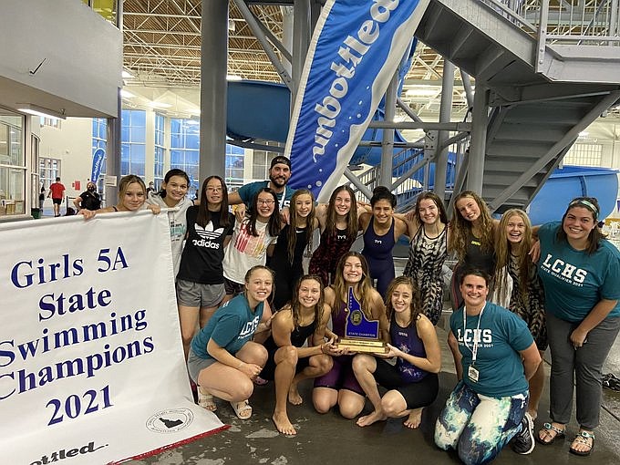 Photo courtesy of Idaho High School Activities Association
The Lake City girls swim team won the state 5A championship in November at the West Valley YMCA and Boise Aquatic Center. In the front row, from left, are: Ada Christensen, Julia Pierce, Camryn Carr, Emma Fritz and coach Shelly Sobek. In the back row, from left, are: Piper Colbert, Jasmine Mielke, Madison Craigie, coach Brady Hooper, Ashlyn Craigie, Amy Fritz, Gabby Garasky, Pema Anain, Riley Taylor, Trista Slife, Demi Blaylock and coach Emma Allison.
