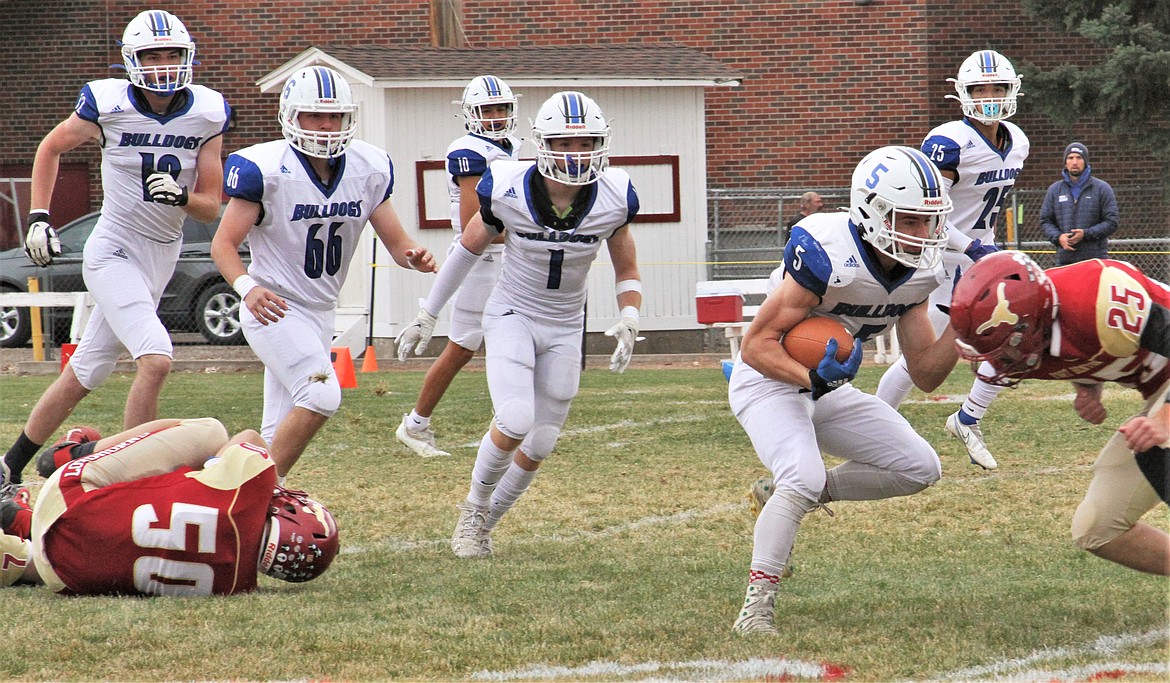 Bulldogs running back Charley Adams takes on a Fort Benton defender. (Courtesy of Daisy Adams)