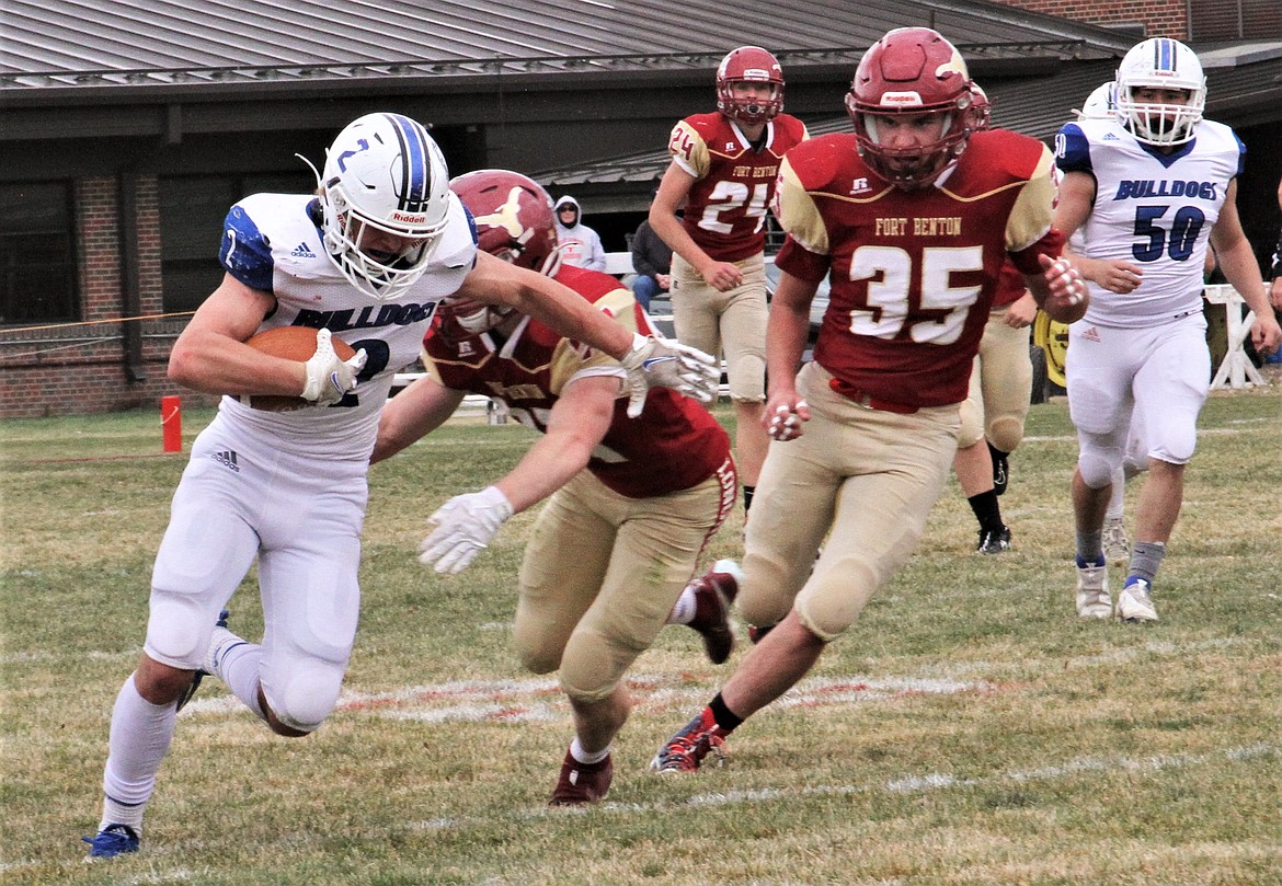 Mission's Canyon Sargent breaks a tackle against Fort Benton. (Courtesy of Daisy Adams)