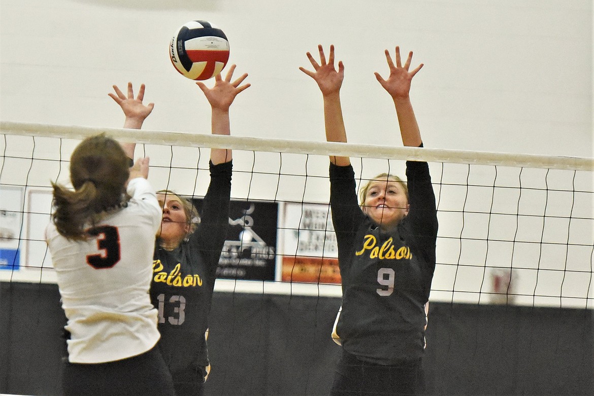 Clara Todd and Grace Simonich defend against a shot by Ronan's Olivia Clairmont the in second Western A championship match. (Scot Heisel/Lake County Leader)