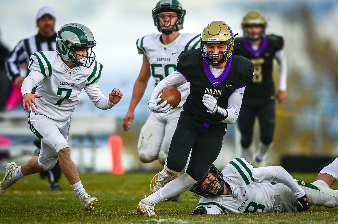 Alex Muzquiz carries the ball against Billings Central. (Casey Kreider/Daily Inter Lake)