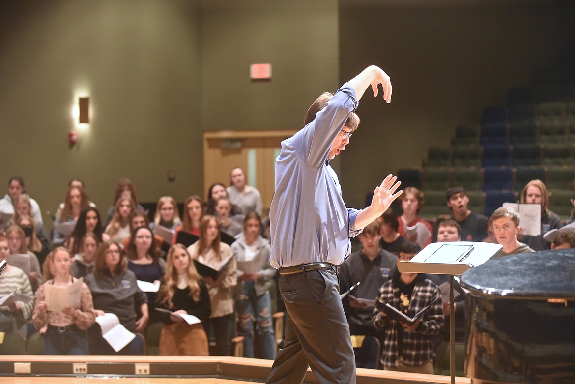 Guest conductor Steven Zielke, director of Choral Studies at Oregon State University, leads choir students from Glacier, Flathead and Great Falls high schools during the AA High School Choral Festival Monday. The festival culminates in a concert set for 5 p.m. Tuesday, Nov. 8, in the Glacier High School performance hall. The concert is free and open to the public. (Hilary Matheson/Daily Inter Lake)