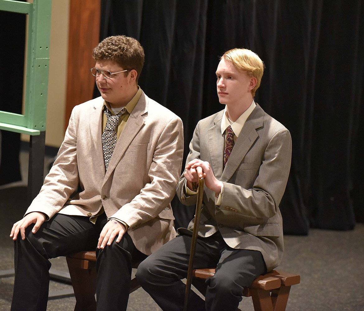 Cole Pickert and Paul Hannigan watch while their fellow jurors state their case during the Whitefish High School Drama Club production of “Twelve Angry Jurors” last week in the Black Box Theatre. (Heidi Desch/Whitefish Pilot)