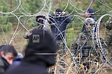 Migrants aided by Belarus try to storm border into Poland