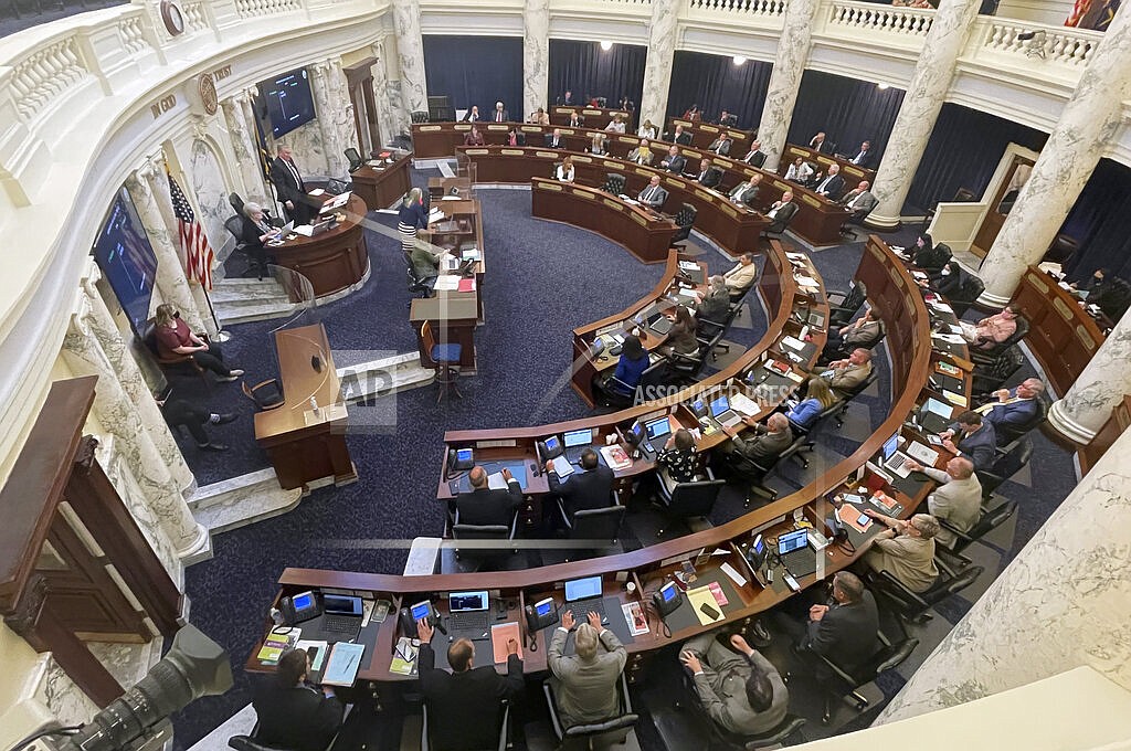 The Idaho House of Representatives works late into the evening at the Statehouse in Boise, Idaho, on Wednesday, May 12, 2021. Due to the unprecedented way lawmakers are reconvening at the Statehouse next week, any laws they pass could end up in court and be declared null. Opponents also say they could target session costs and lawmaker expenses. The House and Senate plan to meet starting Monday, Nov. 8, 2021, to pass a law or laws to thwart President Joe Biden's sweeping vaccine requirements that affect some 100 million Americans. (AP Photo/Keith Ridler, File)