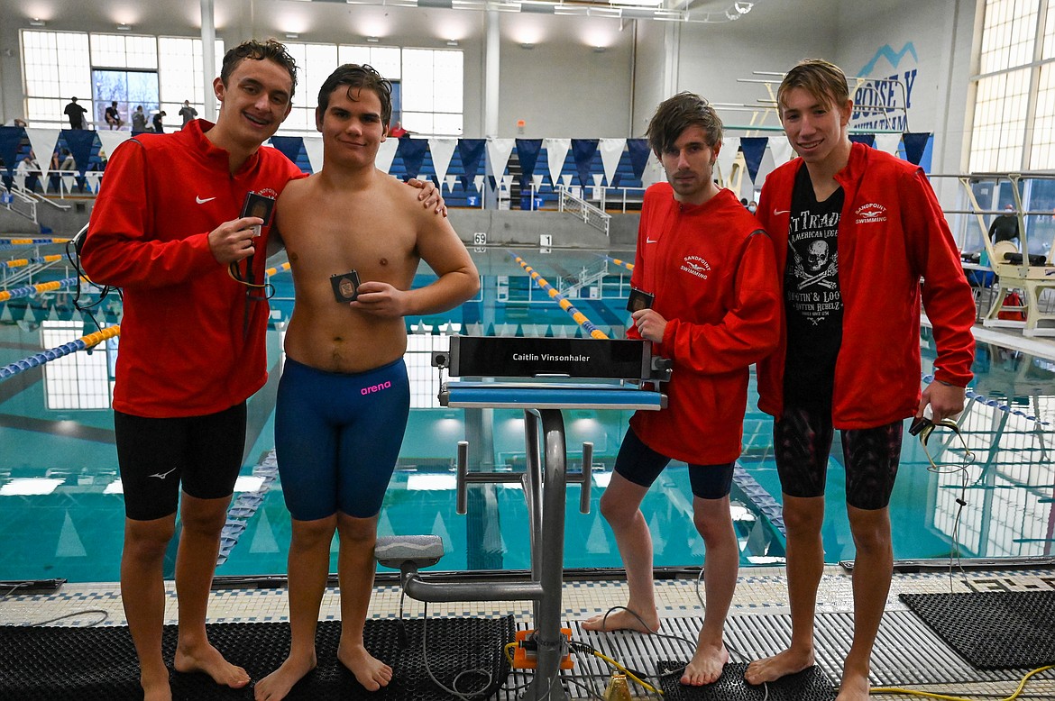 From left: Caleb Norling, Max Zuberbuhler, Jack Grzincic and Hayden Leavitt pose for a photo after capturing third in the 400 freestyle relay.