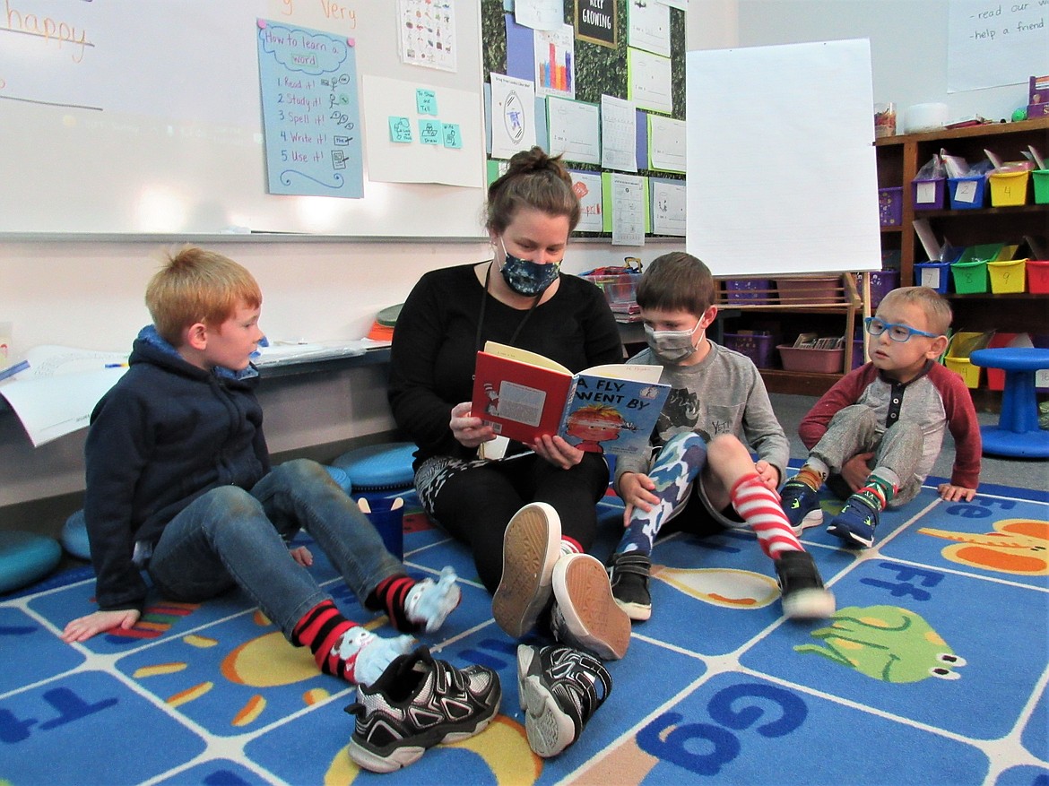 Teacher and students reading during Family Reading Week at Idaho Hill Elementary school.