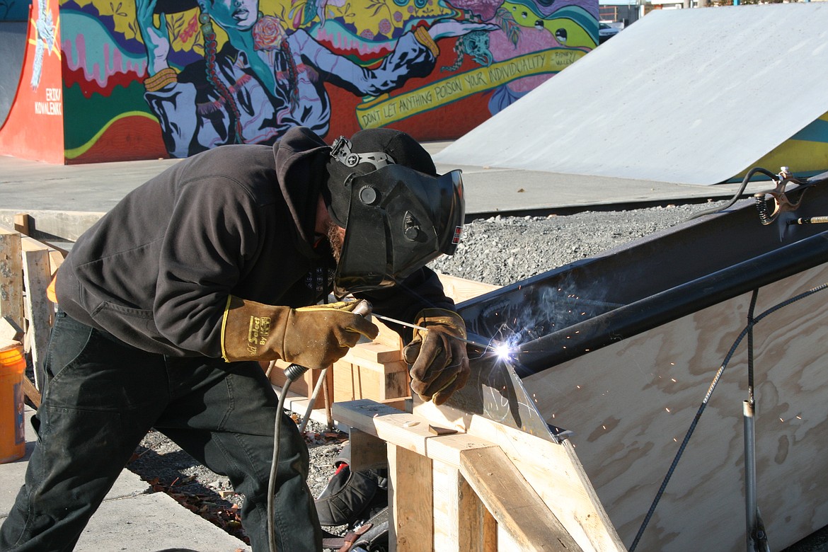 Jack Balerud of Outer Space Concrete & Construction welds a support Monday at the new bowl being added at the Moses Lake Skate Park.