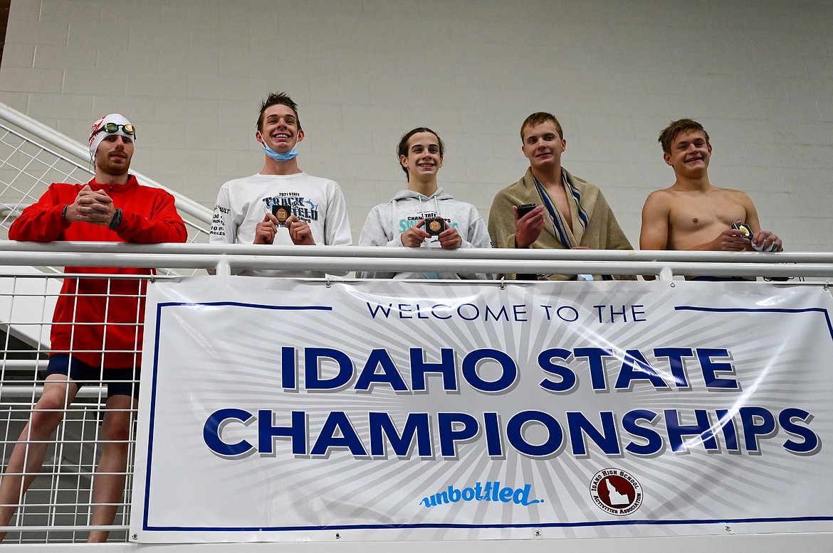 Jack Grzincic (far left) poses for a photo after capturing fifth in the 200 individual medley.