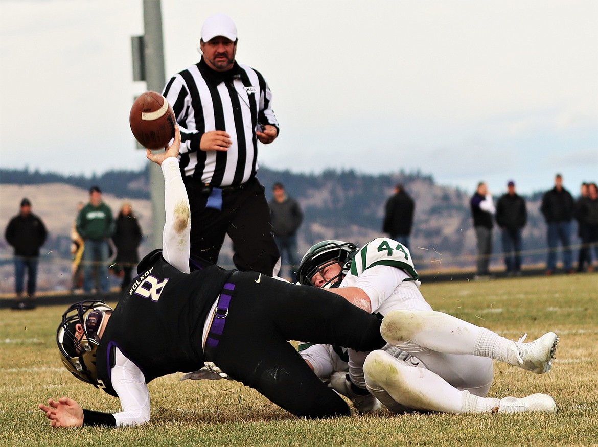 Jarrett Wilson tries unsuccessfully to get off a pass and avoid a sack against Billings Central. (Courtesy of Niki Graham)