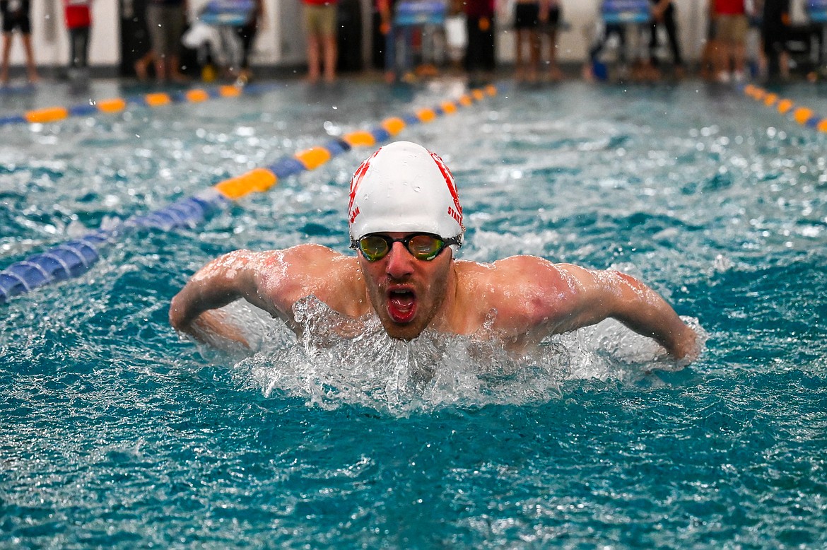 Senior Jack Grzincic competes in the 100-yard butterfly during the 4A state swim meet.