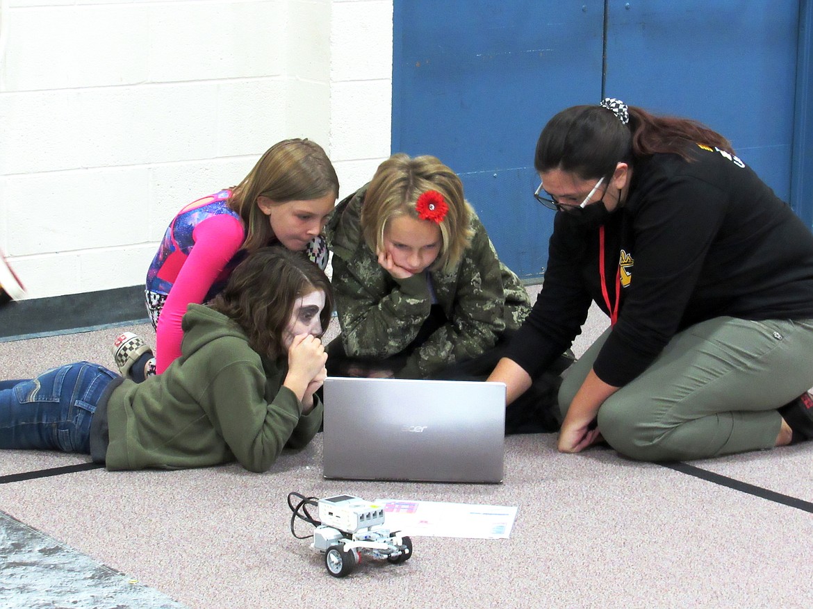 Idaho Hill Elementary students work on Ozobots and robots during a recent visit by UI's NASA team to the school.