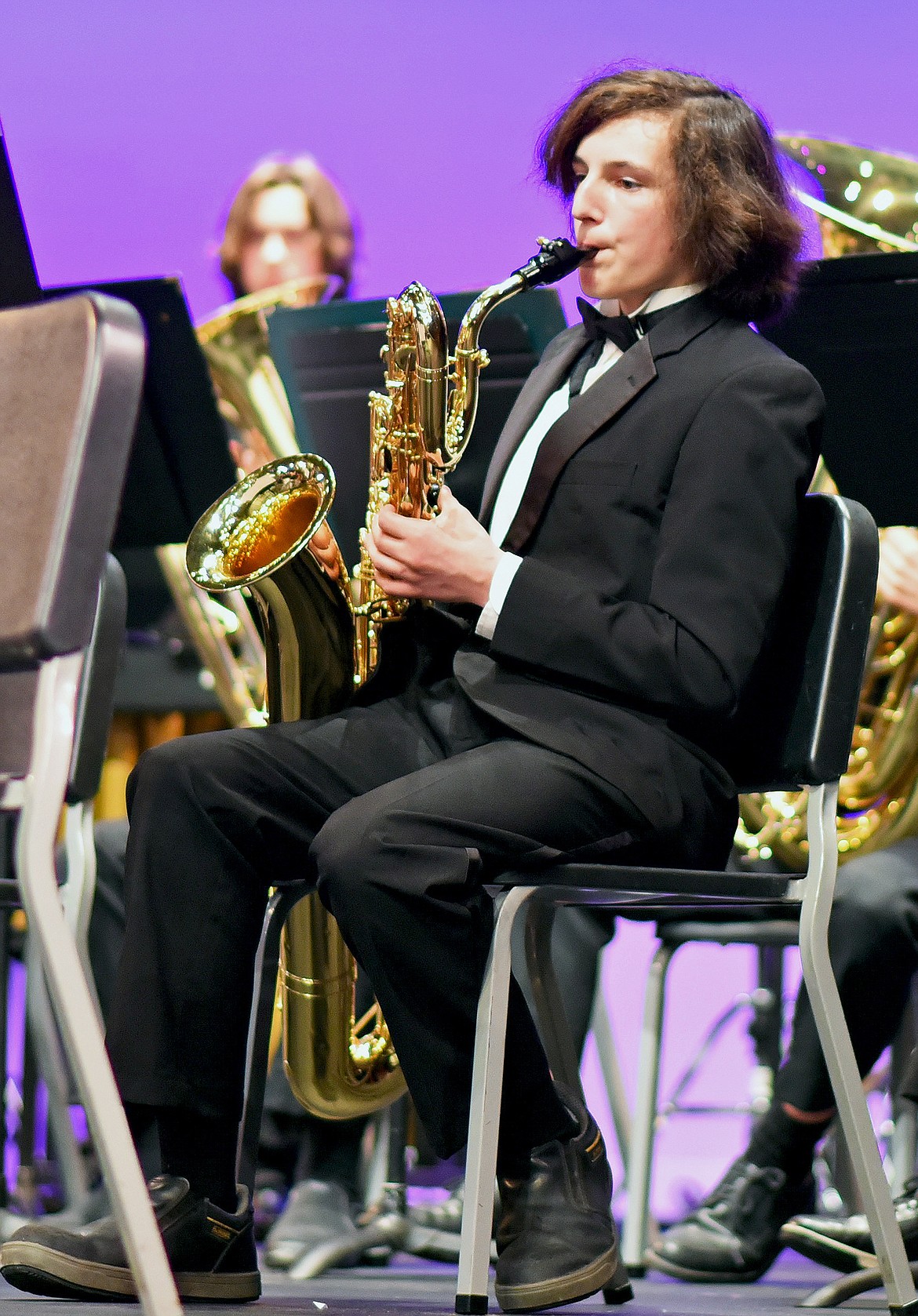 Whitefish High School student Michael Wymer plays the baritone saxophone during the Fall Band Concert on Oct. 28 at the Performing Arts Center in Whitefish. (Whitney England/Whitefish Pilot)