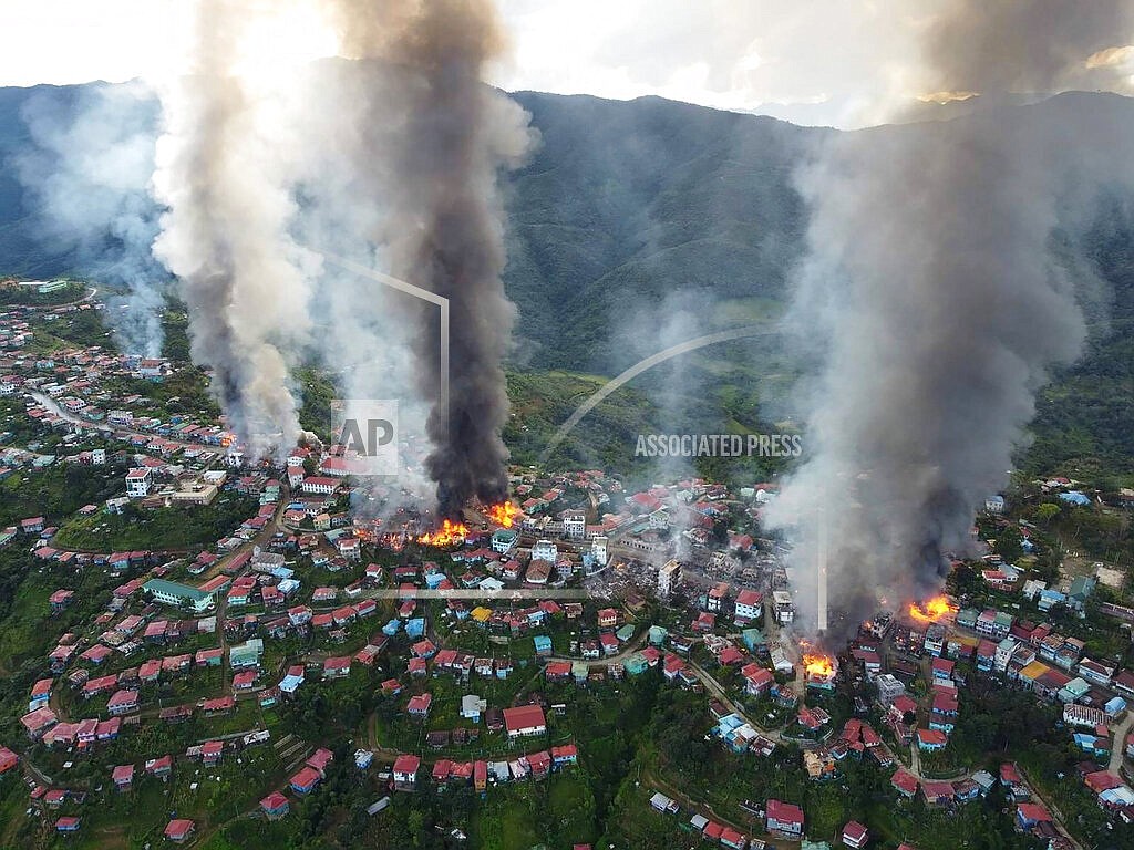 In this photo released by the Chin Human Rights Organization, fires burn in the town of Thantlang in Myanmar's northwestern state of Chin, on Friday Oct. 29, 2021. More than 160 buildings in the town in the northwestern Myanmar, including three churches, have been destroyed by fire caused by shelling by government troops, local media and activists reported Saturday. (Chin Human Rights Organization via AP)