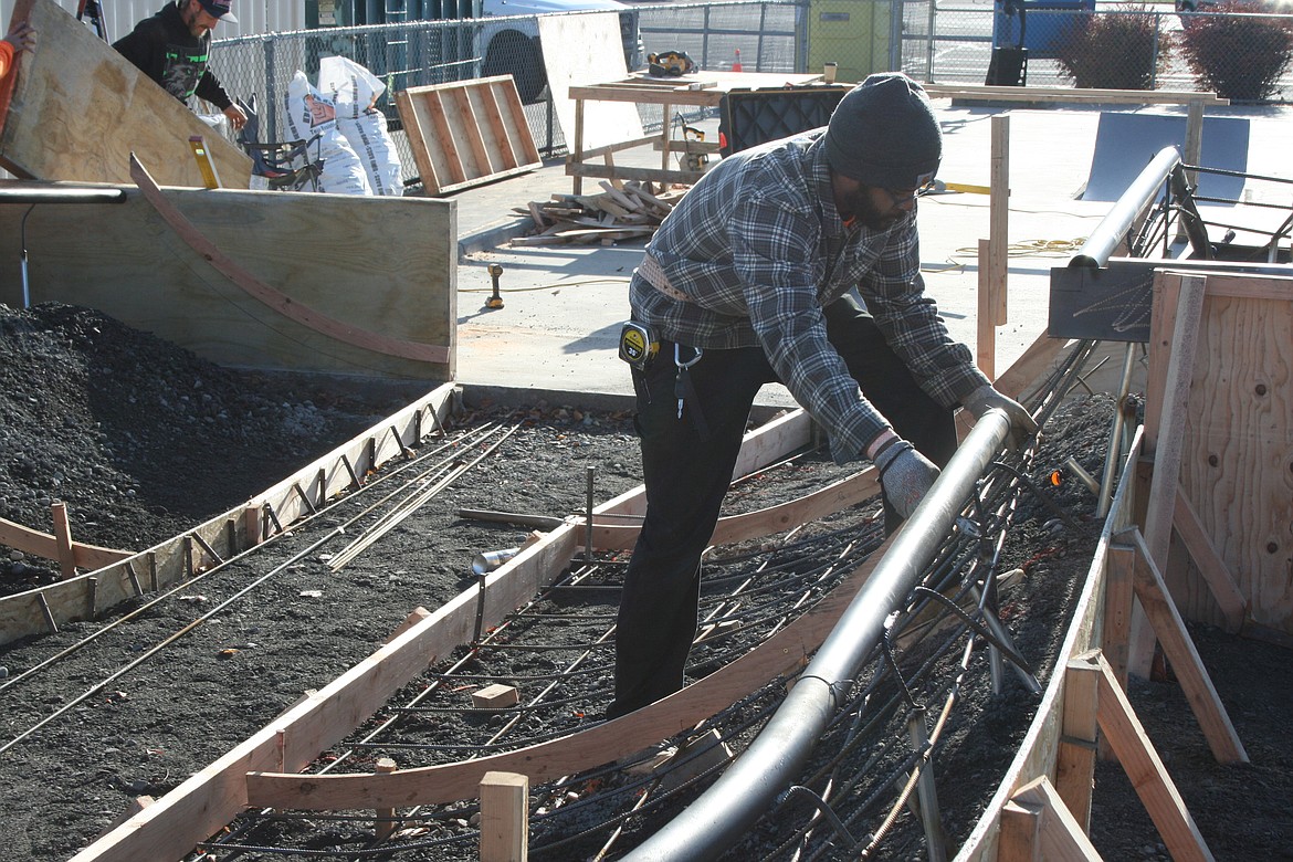 Nygel Mayfield, of Outer Space Concrete & Construction, installs rebar in the shell of the new bowl at the Moses Lake Skate Park Monday.