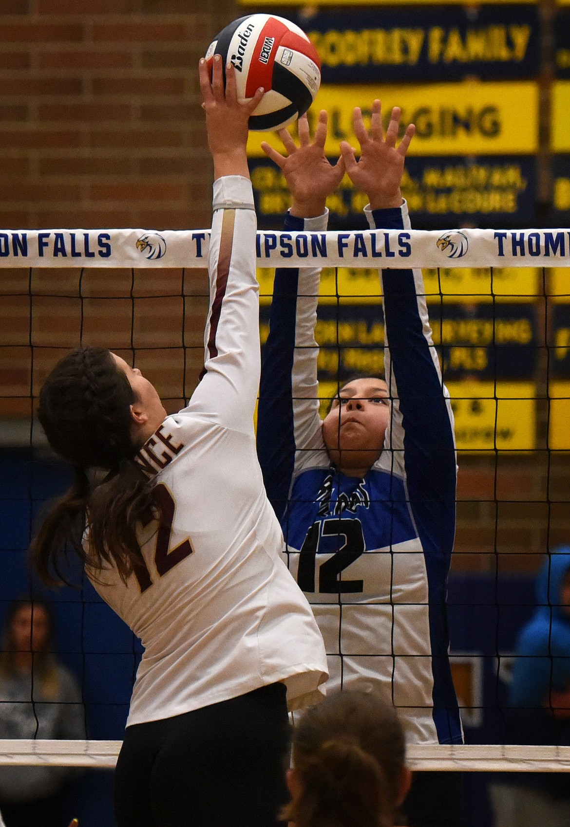 Mission's Emily Morigeau attempts to block Florence Carlton's Quinn Skaggs at the net. (Jeremy Weber/Daily Inter Lake)