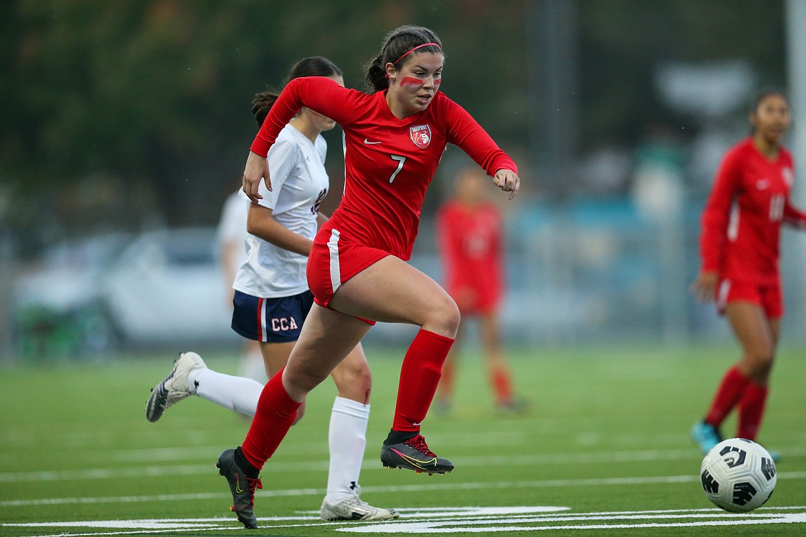 Sierrah VanGesen sprints upfield with the ball during a game against Coeur d'Alene Charter this fall.