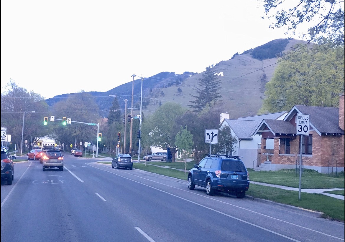 Photo taken in 2020 looking down Sixth Street to traffic light at Arthur Street in Missoula below the "M" mountain