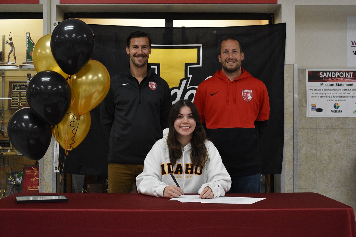 Sandpoint's Sierrah VanGesen signs her National Letter of Intent on Wednesday to play soccer at the University of Idaho next fall. Pictured in the back: Sandpoint girls soccer head coach Conor Baranski (left) and Bulldog assistant coach Alan Brinkmeier.