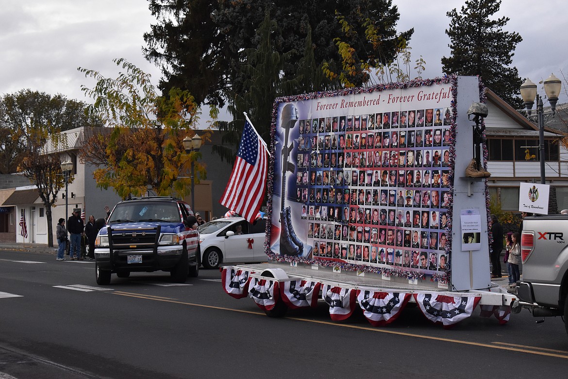 The Time Of Remembrance participates in the Ephrata Veterans Day Parade for the first time. The sign features more than 300 pictures of fallen soldiers on each side of the board and all are from or serve in the Pacific Northwest.