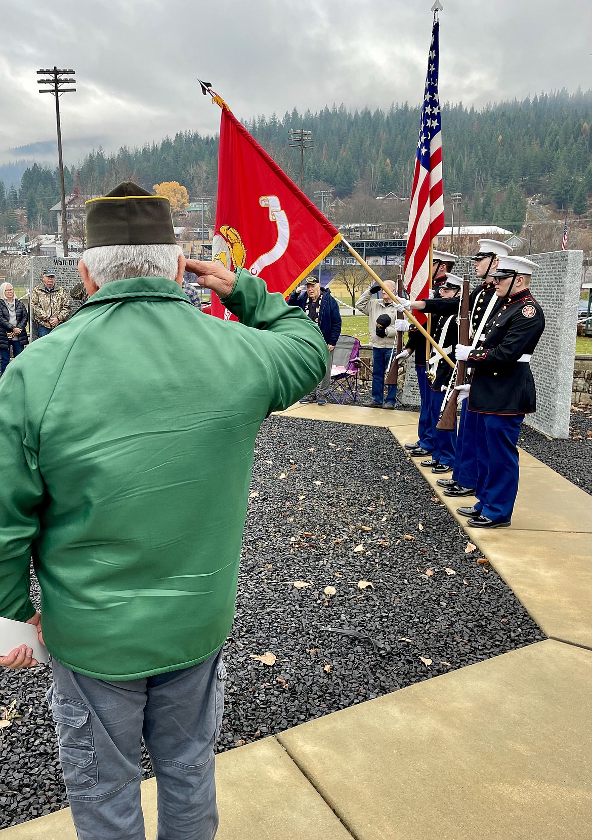 A local veteran salutes the flag during a moment of silence at the Silver Valley Veterans Memorial.