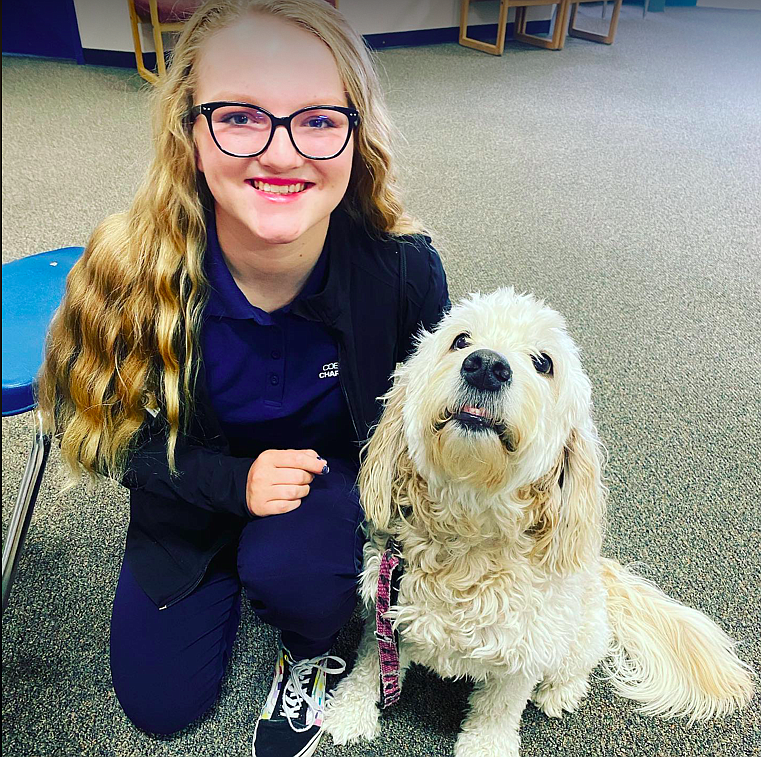 Hailie Velasco, 16, poses with her diabetic alert dog, Rory, a golden doodle. Diagnosed at eight with Type 1 diabetes, Velasco and her mom Lyndsey Neufeld, work with Halo's One Hope to help bring awareness to juvenile diabetes.