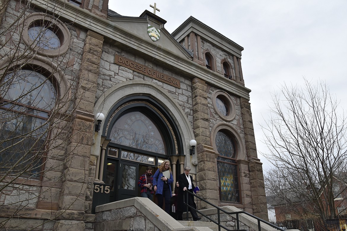 Montana Jewish Project President Rebecca Stanfel, left, and Jewish community member Erin Vang, right, leave the old synagogue in Helena, Montana, Thursday, Nov. 11,2021. The nonprofit Montana Jewish Project purchased the building, originally built as Temple Emanu-El in 1891, from the Helena Catholic Diocese, that had obtained the building in 1981. (AP Photo/Iris Samuels)