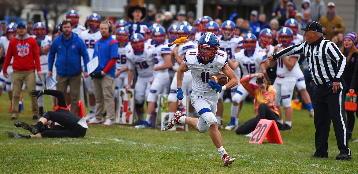 Bigfork's George Bucklin breaks free for a big gain down the sideline in the first quarter of the Class B state semifinal in Eureka Saturday. (Jeremy Weber/Daily Inter Lake)